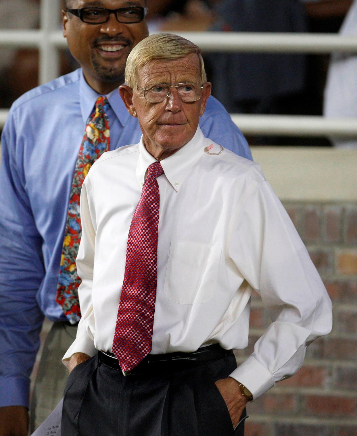 Lou Holtz, front, on the sidelines as an ESPN commentator for an NCAA college football game Monday between Florida State and Miami, Sept. 7, 2009, in Tallahassee, Fla.(AP Photo/Phil Coale)