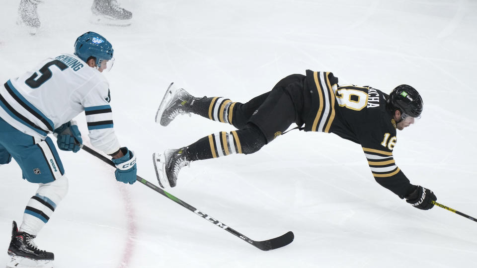 San Jose Sharks defenseman Matt Benning (5) and Boston Bruins center Pavel Zacha collide in the second period of an NHL hockey game, Thursday, Nov. 30, 2023, in Boston. (AP Photo/Steven Senne)