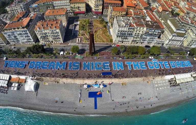 This photo from Image Trans shows Tiens employees arranging themselves in the phrase "Tiens' dream is Nice in the Cote d'Azur" in Nice, France, on May 8, 2015