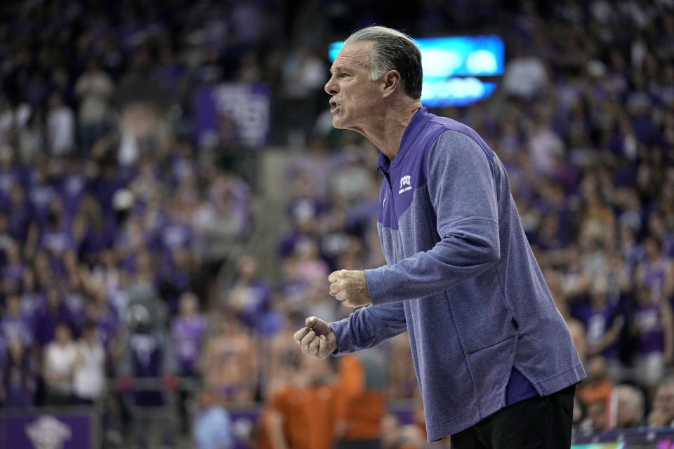 TCU coach Jamie Dixon talks to players during the first half of the team's NCAA college basketball game against Texas, Wednesday, March 1, 2023, in Fort Worth, Texas. (AP Photo/Tony Gutierrez)