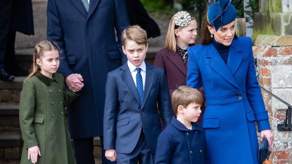 Princess Kate in blue alongside her three kids