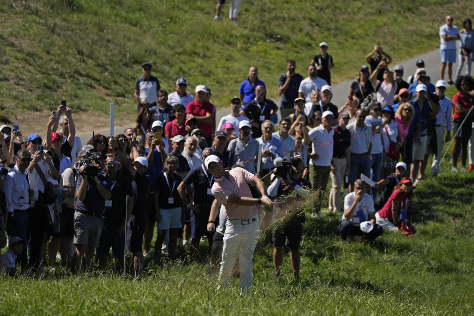 FILE - Rory McIlroy of Northern Ireland, hits from the fairway during the Italian Open golf tournament at Marco Simone in Guidonia Montecelio, Italy, Sunday, Sept. 18, 2022. Marco Simone hosts the Ryder Cup that starts Sept. 29. McIlroy believes winning an away Ryder Cup is among golf's greatest accomplishments. (AP Photo/Alessandra Tarantino, File)