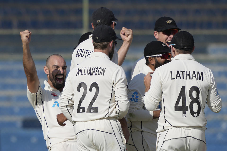 New Zealand's Daryl Mitchell, left, and teammates react after third umpire given out to Pakistan's Sarfraz Ahmed during the third day of the second test cricket match between Pakistan and New Zealand, in Karachi, Pakistan, Wednesday, Jan. 4, 2023. (AP Photo/Fareed Khan)