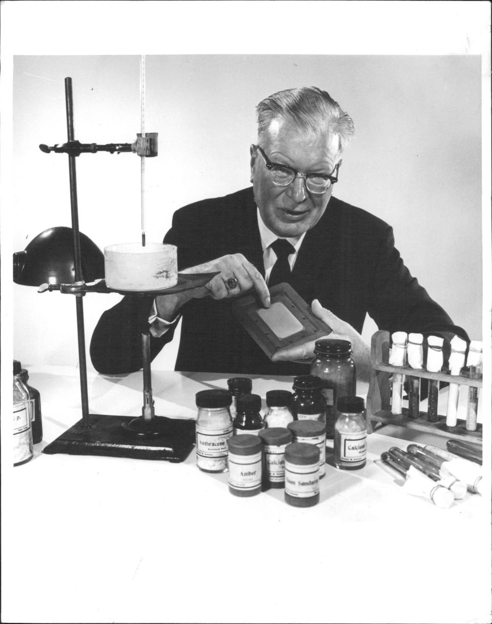 Chester Carlson, inventor of xerography, shows materials used in early experiments regarding the xerographic process.