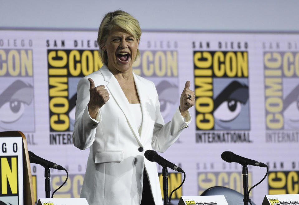 Linda Hamilton reacts to the audience as she walks on stage at the "Terminator: Dark Fate" panel on day one of Comic-Con International on Thursday, July 18, 2019, in San Diego. (Photo by Chris Pizzello/Invision/AP)