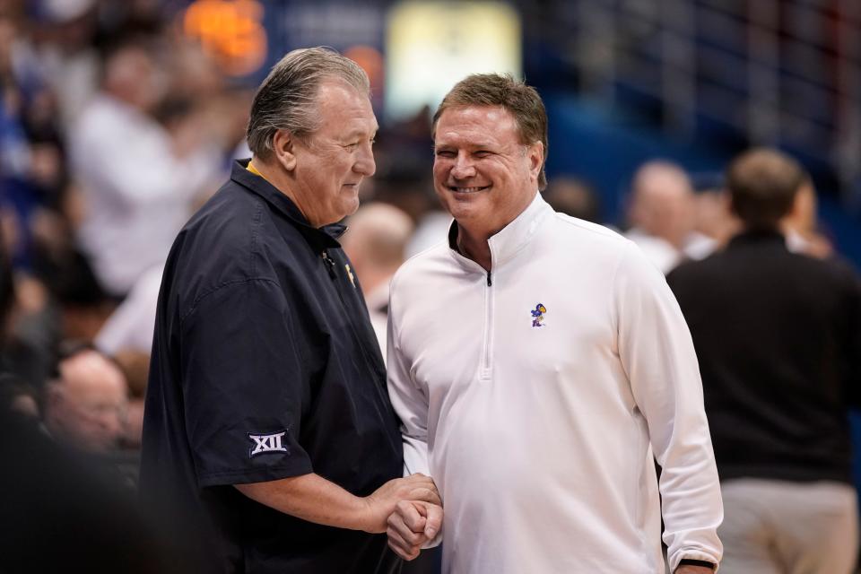 West Virginia head coach Bob Huggins with Kansas head coach Bill Self.