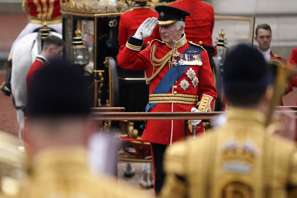 Britain's King Charles III takes a salute as he attends the Trooping the Color ceremony, in London, Saturday, June 15, 2024. Trooping the Color is the King's Birthday Parade and one of the nation's most impressive and iconic annual events attended by almost every member of the Royal Family. (AP Photo/Alberto Pezzali)