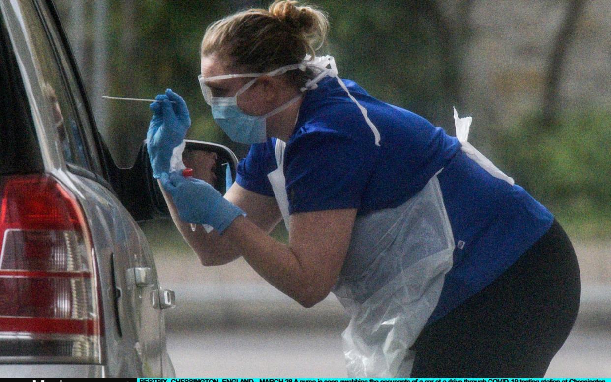 A nurse tests for Covid-19 at a testing station at Chessington - Peter Summers/Getty Images