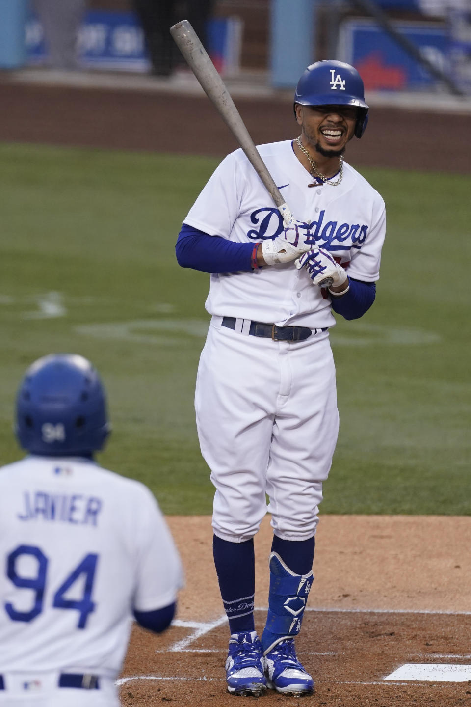 Los Angeles Dodgers' Mookie Betts reacts after being hit with a pitch by Los Angeles Angels starting pitcher Julio Teheran during the first inning of a baseball game Saturday, Sept. 26, 2020, in Los Angeles. (AP Photo/Ashley Landis)