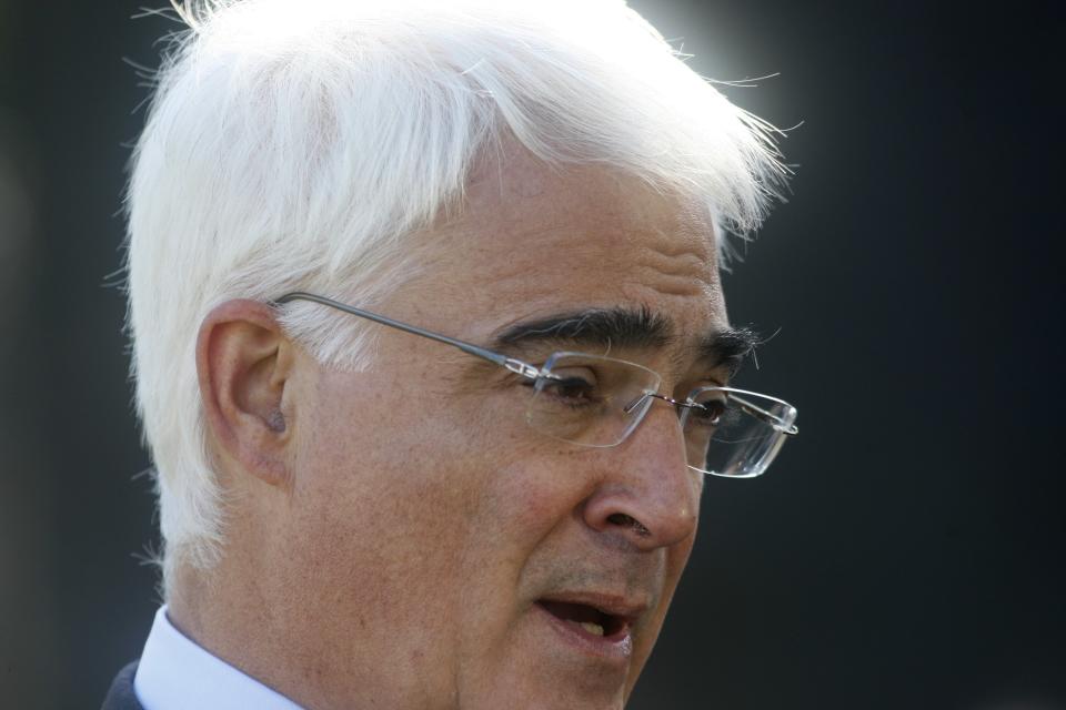 Former Britain's finance chief, Alistair Darling speaks to a media outside the Houses of Parliament in London, Wednesday, Oct. 20, 2010. Britain's finance chief George Osborne is due to present a Comprehensive Spending Review to parliament Wednesday giving details of how the government propose to tackle the continuing financial deficit. (AP Photo/Sang Tan)