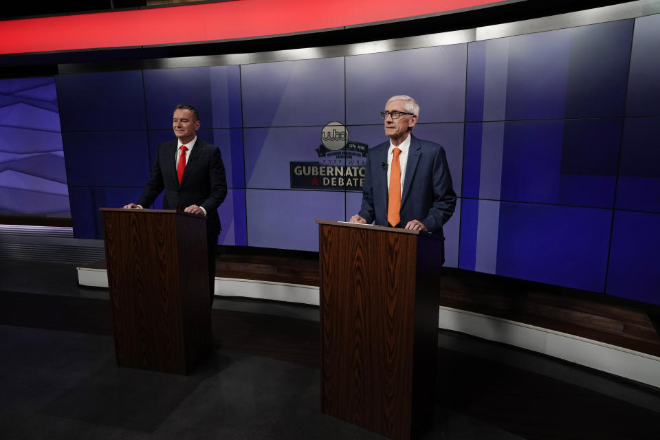 Wisconsin Republican gubernatorial candidate Tim Michels, left, and Democratic gubernatorial candidate Tony Evers prepare for a televised debate Friday, Oct. 14, 2022, in Madison, Wis. (AP Photo/Morry Gash)