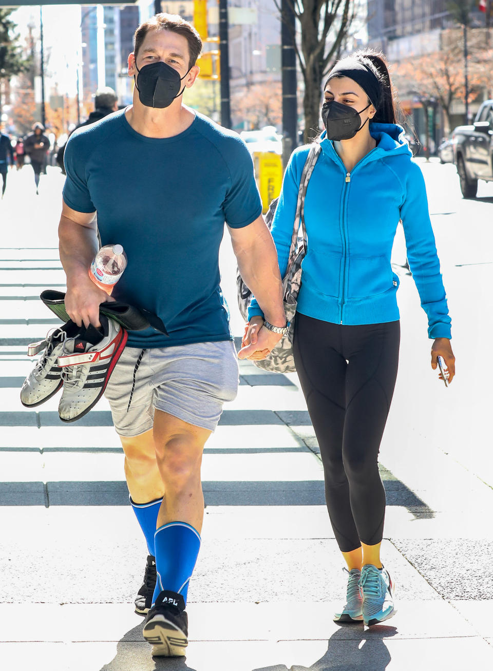 <p>John Cena holds hands with wife Shay Shariatzadeh while out in Vancouver on Sunday.</p>