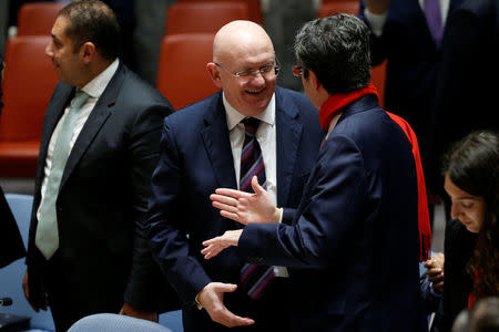 Russian Ambassador to the United Nations (UN) Vasily Nebenzya speaks with Permanent Representative of France to the UN Francois Delattre before a meeting of the UN Security Council to vote on a bid to renew an international inquiry into chemical weapons attacks in Syria during a meeting at the UN headquarters in New York, U.S., November 16, 2017. REUTERS/Lucas Jackson