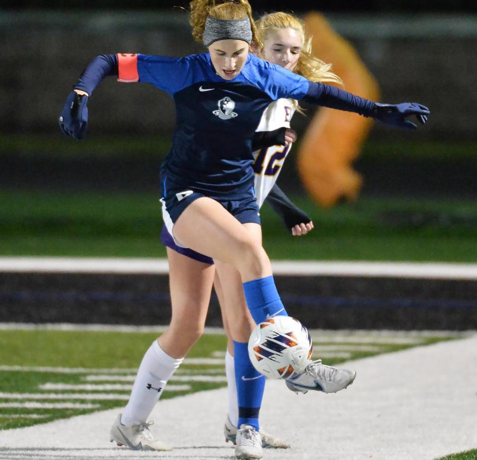 McDowell junior Claire Faulhaber, front, and Erie High freshman Kennedy Hildebrand compete during the District 10 Class 6A girls soccer championship at Dollinger Field, Hagerty Family Events Center, in Erie. McDowell won 9-0.