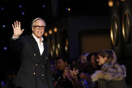 Designer Tommy Hilfiger acknowledges attendees after presenting his Fall/Winter 2016 collection during New York Fashion Week February 15, 2016. REUTERS/Andrew Kelly