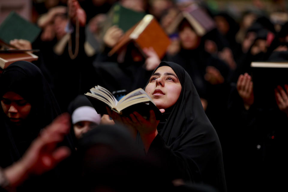 FILE - Shiite worshippers attend Laylat al-Qadr, or Qadr Night prayer during the holy Islamic month of Ramadan, in Najaf, Iraq, Tuesday, April 11, 2023. In the Middle East and North Africa, where religion is often ingrained in daily life's very fabric, rejecting faith can come with social or other repercussions, so many of the "nones," a group that includes agnostics, atheists and "nothing in particular" conceal that part of themselves, as blasphemy laws and policies are widespread in the region. (AP Photo/Anmar Khalil)