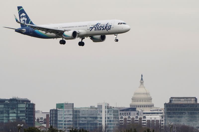 FILE PHOTO: An Alaska Airlines aircraft lands at Reagan National Airport in Arlington, Virginia