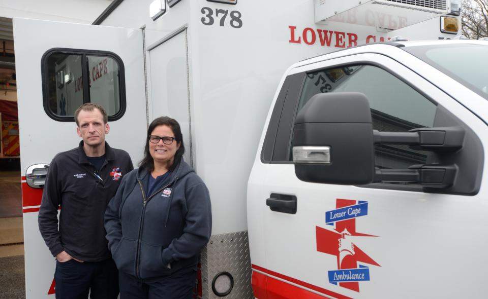 At the upcoming annual town meeting on April 3, the town of Provincetown will ask voters to maintain level service with Lower Cape Ambulance Association and for the first time hire full-time firefighter/EMTs and paramedics. Lower Cape Ambulance Association employees Patrick O'Neal and Lisa Potter stand outside the fire station in Provincetown, in a January photo.
