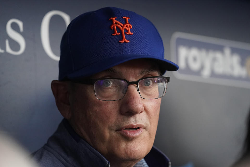 FILE - New York Mets owner Steve Cohen talks to the media in the dugout before a baseball game against the Kansas City Royals, Aug. 2, 2023, in Kansas City, Mo. Cohen says his team can still turn around its season and fans “have been through worse." Cohen praised his front office and manager Carlos Mendoza during a news conference before the final of the two-game London Series, Sunday, June 9,. 2024. (AP Photo/Charlie Riedel)