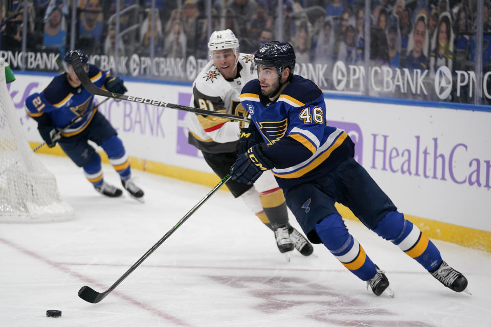 St. Louis Blues' Jake Walman (46) handles the puck as Vegas Golden Knights' Jonathan Marchessault (81) watches during the third period of an NHL hockey game Wednesday, April 7, 2021, in St. Louis. (AP Photo/Jeff Roberson)