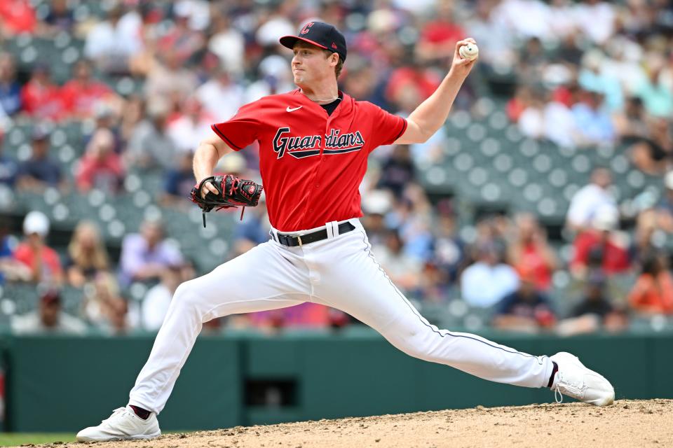 Cleveland Guardians relief pitcher Tim Herrin delivers during the eighth inning in the continuation of a suspended baseball game against the Los Angeles Dodgers, Thursday, Aug. 24, 2023, in Cleveland. The game was suspended the night before due to inclement weather. (AP Photo/Nick Cammett)