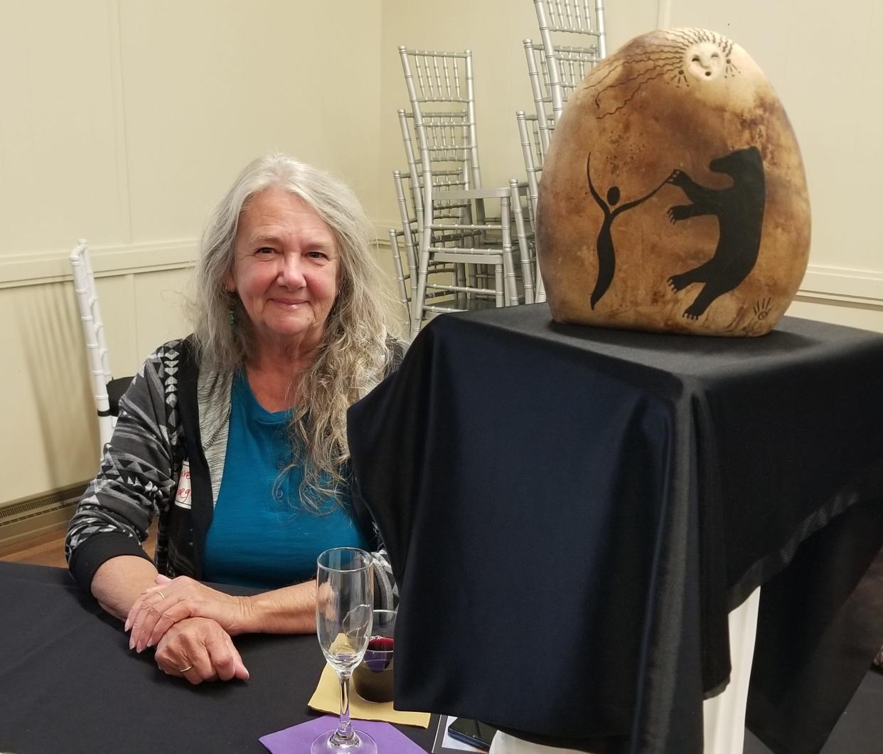 Beverly Morgan with her artwork.