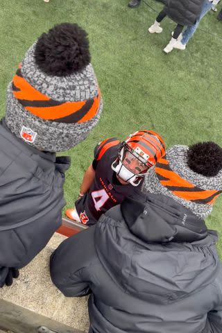 <p>Katherine Webb/Instagram</p> Katherine Webb-McCarron and sons are greeted by AJ McCarron at his first NFL game in almost three years.