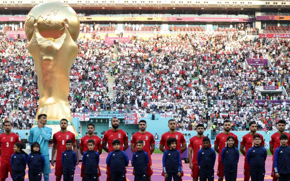 The Iran players ‘listening’ to the national anthem prior to their opening game in the World Cup 2022 in Qatar against England - Fadel Senna/AFP