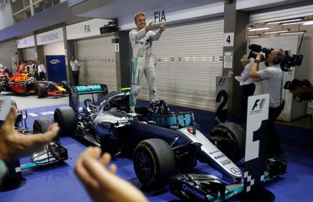 Formula One - F1 - Singapore Grand Prix - Marina Bay, Singapore- 18/9/16 Mercedes' Nico Rosberg of Germany celebrates winning the race. REUTERS/Edgar Su