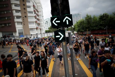 People take part in the "Reclaim Hung Hom and To Kwa Wan, Restore Tranquility to Our Homeland" demonstration against the extradition bill in To Kwa Wan neighborhood, Hong Kong