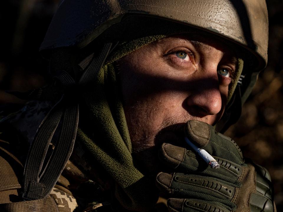 A Ukrainian serviceman smokes a cigarette at his position at the frontline near Bakhmu (AP)