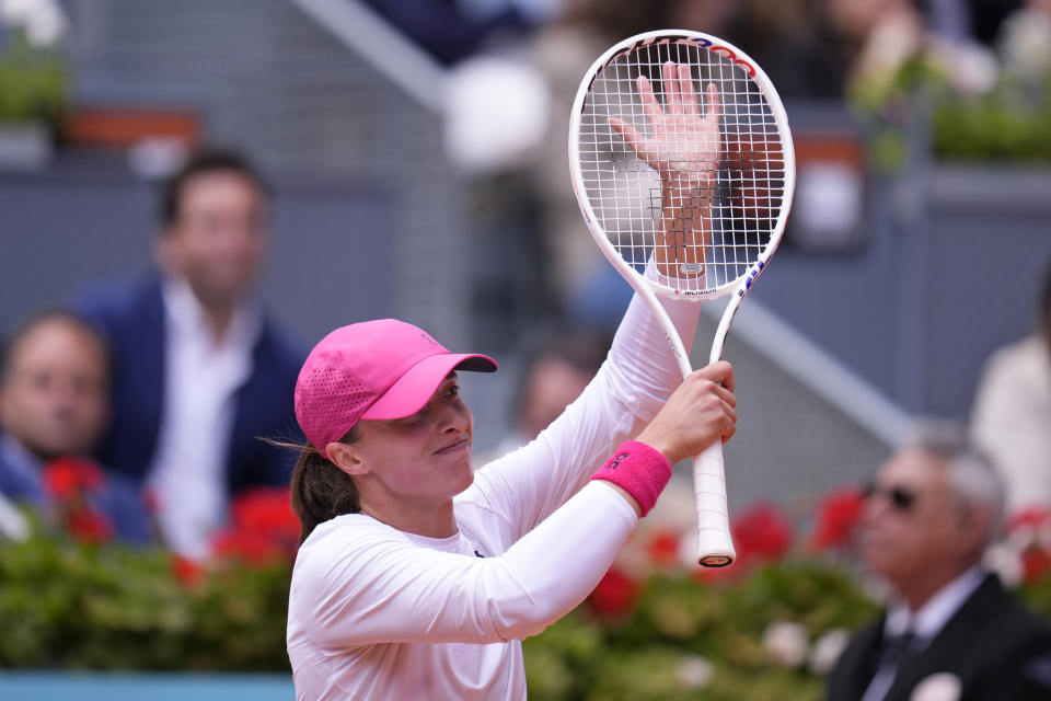 Iga Swiatek of Poland celebrates after defeating Madison Keys of USA during the Mutua Madrid Open tennis tournament in Madrid, Spain, Thursday, May 2, 2024. (AP Photo/Manu Fernandez)