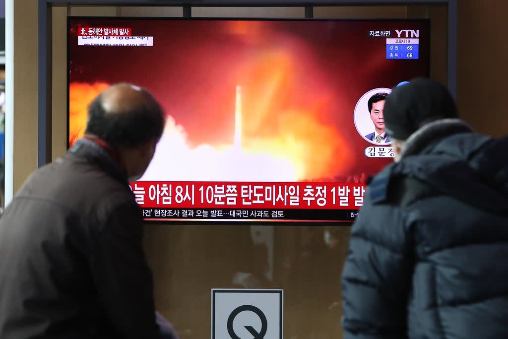 People watch a TV at the Seoul Railway Station showing a file image of a North Korean missile launch, on January 05, 2022 in Seoul, South Korea (Getty Images)