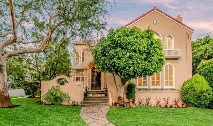 Built in 1925, the Spanish-style home stays in touch with its roots with dramatic arched windows and tray ceilings.