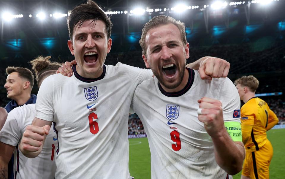 Harry Maguire celebrates with Harry Kane