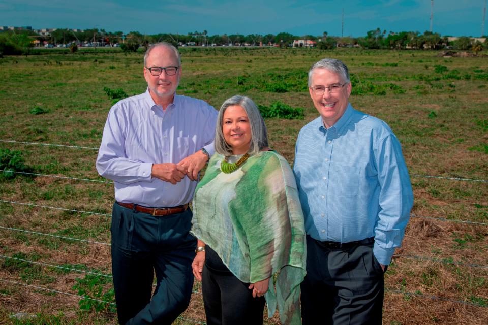 From left, Sarasota Orchestra Board Chair Tom Koski, Chief Financial Officer Cathy Wilson and President and CEO Joseph McKenna stand on the 32-acre Fruitville Road site where the organization plans to build a new music center.