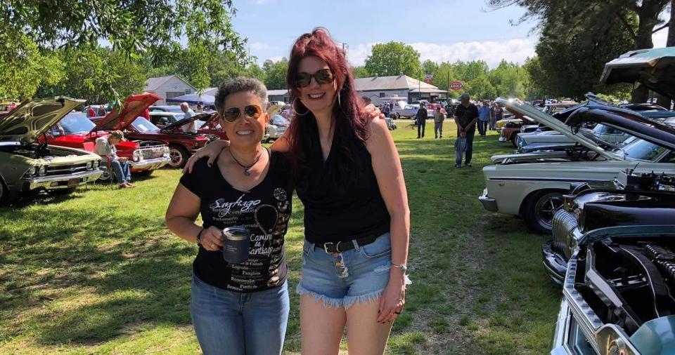 On the grounds of Michelle Olgers's Sutherland's Tavern, she strikes a pose with Suzy Speed, Old School Hot Rodders of Virginia ambassador, at the spring cruise in on May 6, 2023.