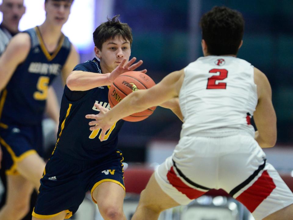 Wayne’s Stephen Habecker, left, knocks the ball away from Friends Academy's Myles Morris during a NYSPHSAA Class A Boys Basketball Championships semifinal in Glens Falls, N.Y., Friday, March 15, 2024. Wayne advanced to the Class A final with a 61-48 win over Friends Academy-VIII.