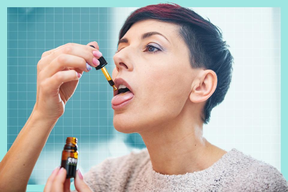 Adult Woman Dripping CBD Cannabis Oil in Her Mouth