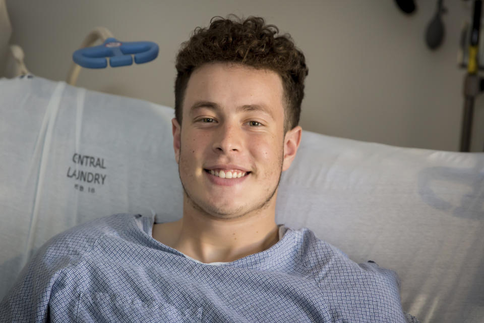 In this Tuesday, Jan. 7, 2020, photo provided by University of Utah Health, Nicolas Stacy-Alcantara, 17, of Fresno, Calif., poses for a photo at University of Utah Hospital in Salt Lake City, where he is recovering after surviving a night alone on the Utah mountains. (Jen Pilgreen/University of Utah Health via AP)