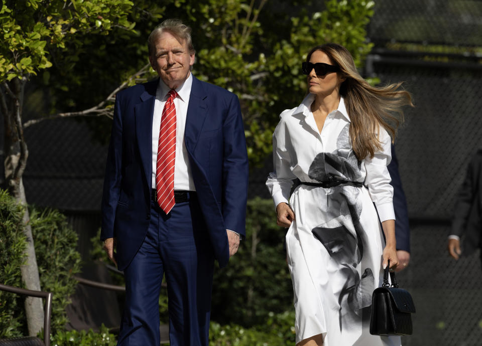 PALM BEACH, FLORIDA - MARCH 19:  Former U.S. President Donald Trump and former first lady Melania Trump walk together as they prepare to vote at a polling station setup in the Morton and Barbara Mandel Recreation Center on March 19, 2024, in Palm Beach, Florida.  Trump, along with other registered Republican voters, cast ballots in the Presidential Preference Primary. There wasn't a ballot or election for Democrats since the Florida Democratic Party only provided the name of Joseph R. Biden Jr. (Photo by Joe Raedle/Getty Images)