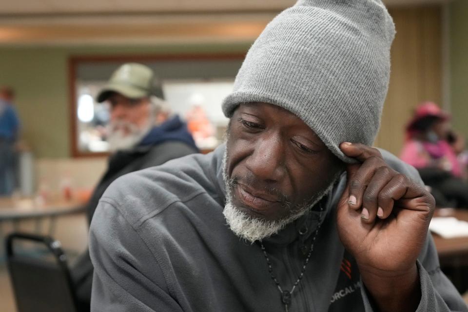 Benjamin Gordon, who is homeless, talks about the cold weather at Central Presbyterian Church on Thursday. People experiencing homelessness often become resources for one another, sharing information about shelter availability and warming centers.