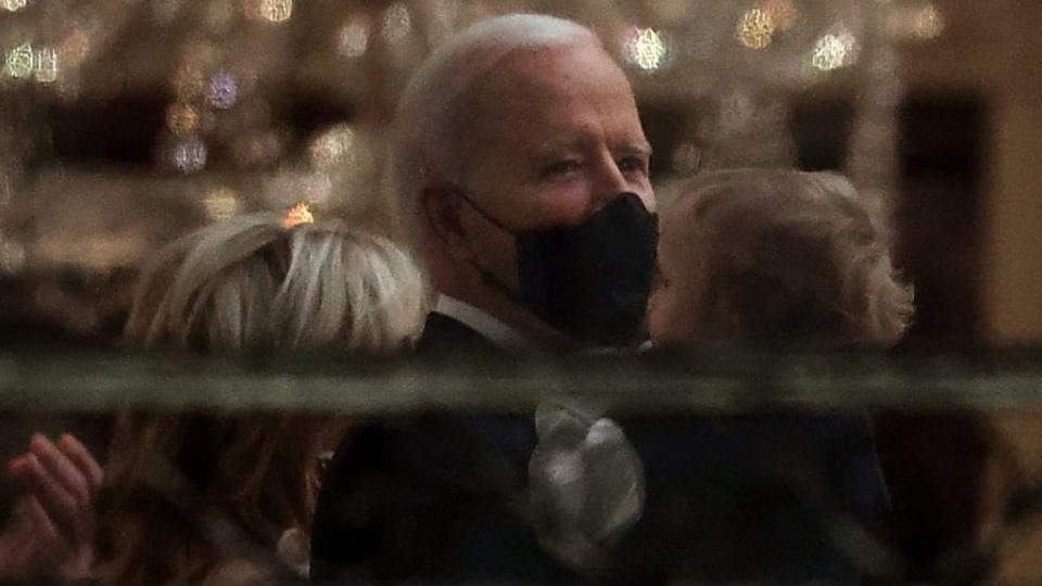 President Joe Biden holds his grandson <span class="caas-xray-inline-tooltip"><span class="caas-xray-inline caas-xray-entity caas-xray-pill rapid-nonanchor-lt" data-entity-id="Beau_Biden" data-ylk="cid:Beau_Biden;pos:2;elmt:wiki;sec:pill-inline-entity;elm:pill-inline-text;itc:1;cat:OfficeHolder;" tabindex="0" aria-haspopup="dialog"><a href="https://search.yahoo.com/search?p=Beau%20Biden" data-i13n="cid:Beau_Biden;pos:2;elmt:wiki;sec:pill-inline-entity;elm:pill-inline-text;itc:1;cat:OfficeHolder;" tabindex="-1" data-ylk="slk:Beau Biden;cid:Beau_Biden;pos:2;elmt:wiki;sec:pill-inline-entity;elm:pill-inline-text;itc:1;cat:OfficeHolder;" class="link ">Beau Biden</a></span></span> before watching his inauguration-night fireworks show on the National Mall from the Truman Balcony at the White House Wednesday night. (Photo by Chip Somodevilla/Getty Images)
