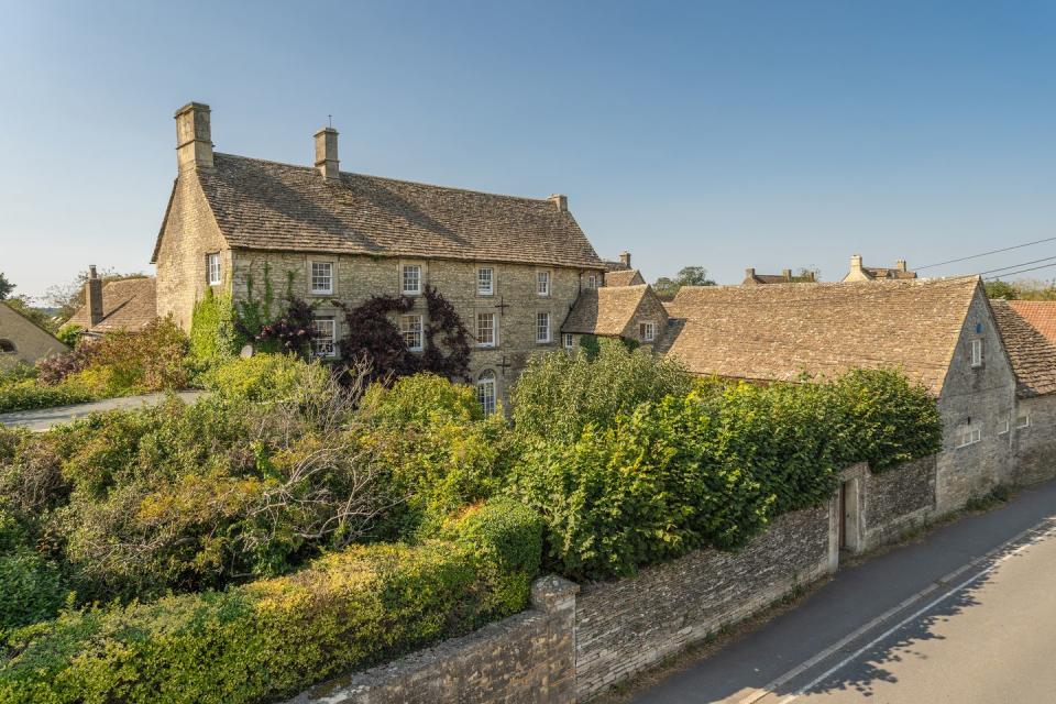 <p>This charming honey-hued building was once rumoured to be viewed by Prince Harry and Meghan Markle before moving to America. Dating back to the 18th century, it's also just a mere 15 minute drive to Highgrove — the family residence of the Prince of Wales and the Duchess of Cornwall. </p><p><a href="https://www.knightfrank.co.uk/properties/residential/for-sale/the-street-luckington-chippenham-wiltshire-sn14/CIR110214" rel="nofollow noopener" target="_blank" data-ylk="slk:This property is currently on the market for £2,500,000 via Knight Frank.;elm:context_link;itc:0;sec:content-canvas" class="link ">This property is currently on the market for £2,500,000 via Knight Frank.</a><br></p>