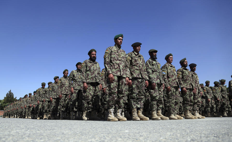 Afghan National Army soldiers attend their graduation ceremony from a 3-month training program at the Afghan Military Academy in Kabul, Afghanistan, Monday, May 27, 2019. (AP Photo/Rahmat Gul)