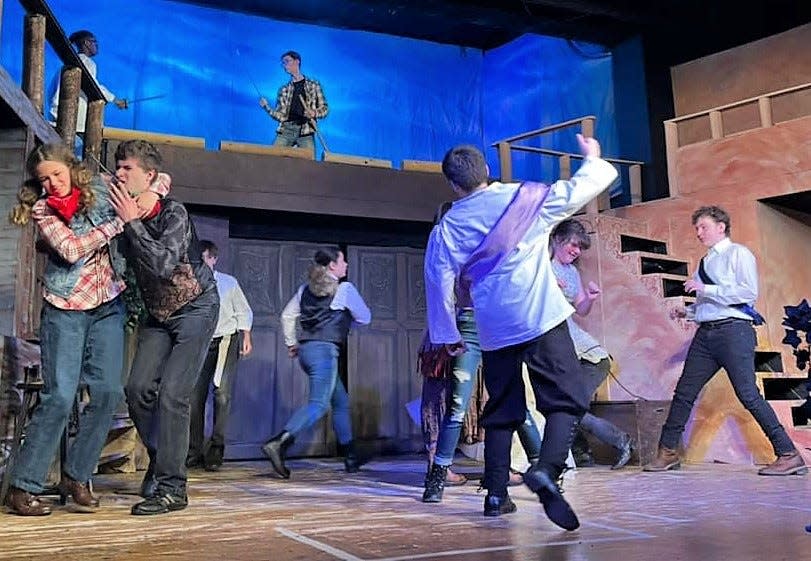 A fight between the two families breaks out among the cast members of the Zane Trace Players production of "Romeo and Juliet" transported to the old west.