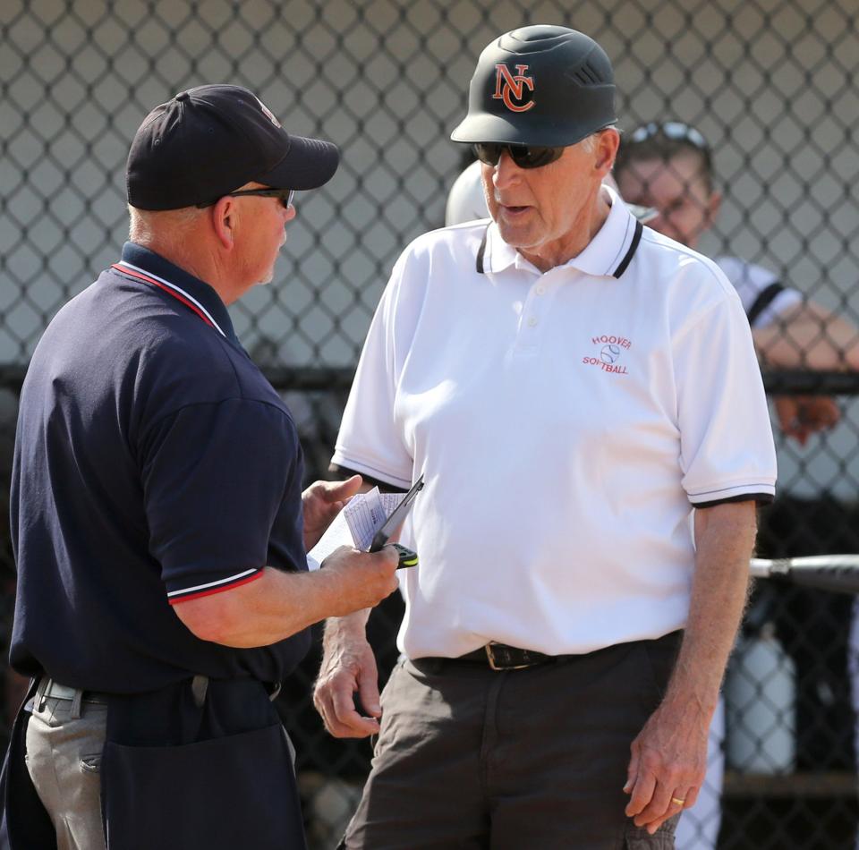 Jerry Goodpasture, head coach at Hoover, speaks to an official during their DI sectional final against Madison at Hoover on Wednesday, May 11, 2022.