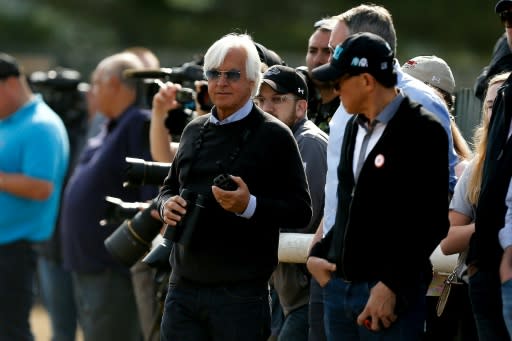 Bob Baffert (C), trainer of Triple Crown and Belmont Stakes contender Justify, seen during morning training prior to the 150th running of the Belmont Stakes, at Belmont Park in Elmont, New York, on June 8, 2018