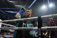 Canelo Alvarez motions from the ring before fighting Jaime Munguia in a super middleweight title fight Saturday, May 4, 2024, in Las Vegas. (AP Photo/John Locher)