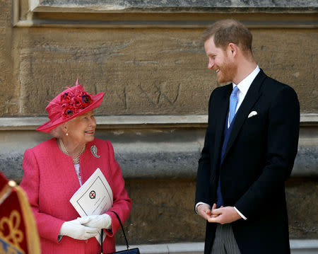 Queen Elizabeth II talks to Prince Harry as they leave after the wedding of Lady Gabriella Windsor and Thomas Kingston at St George's Chapel in Windsor Castle, near London, Britain May 18, 2019. Steve Parsons/Pool via REUTERS